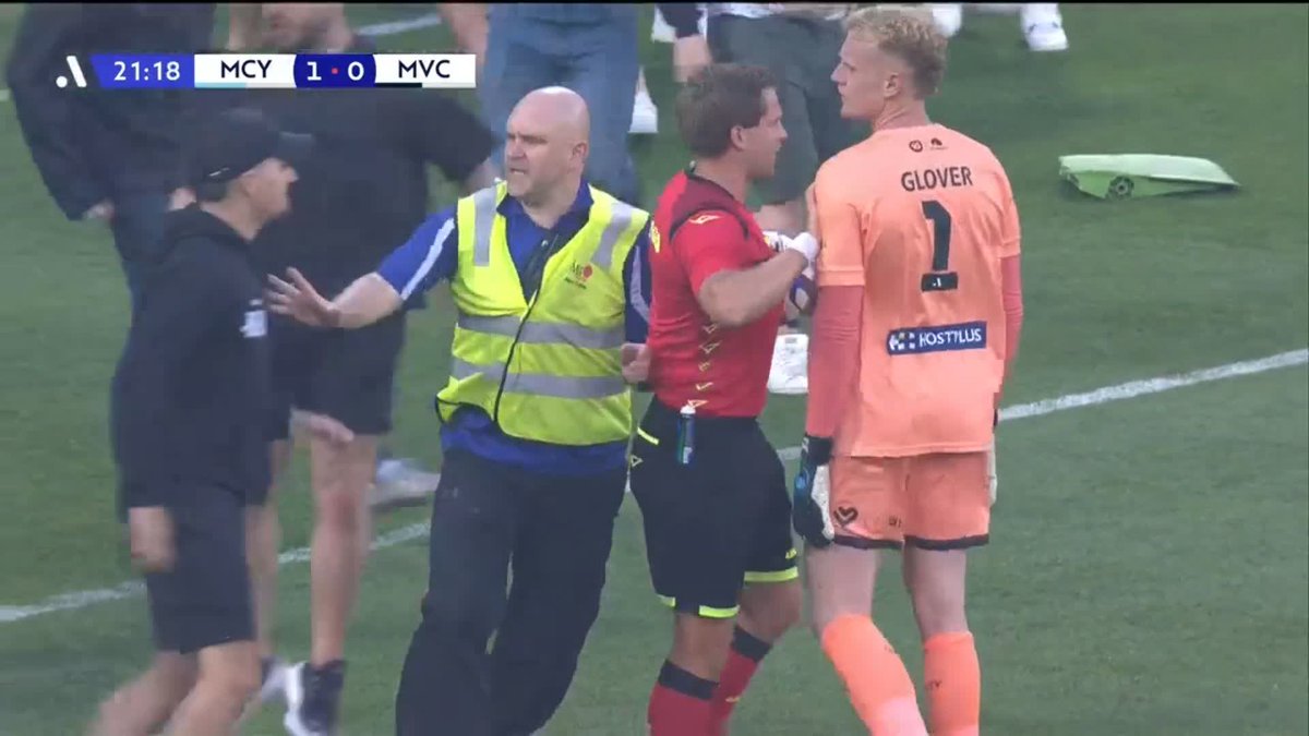 The Isuzu UTE A-League Melbourne Derby at AAMI Park has been suspended after Melbourne City FC goalkeeper Thomas Glover was left with a bloodied face after a bin was thrown at his head following a pitch invasion.