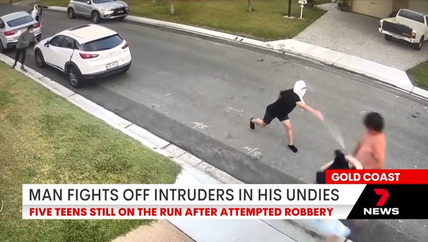 A father wearing only his underwear has fought off five armed teenagers after they tried to rob is home on the Gold Coast. The teens got away in two stolen cars and are still on the run. #7NEWS