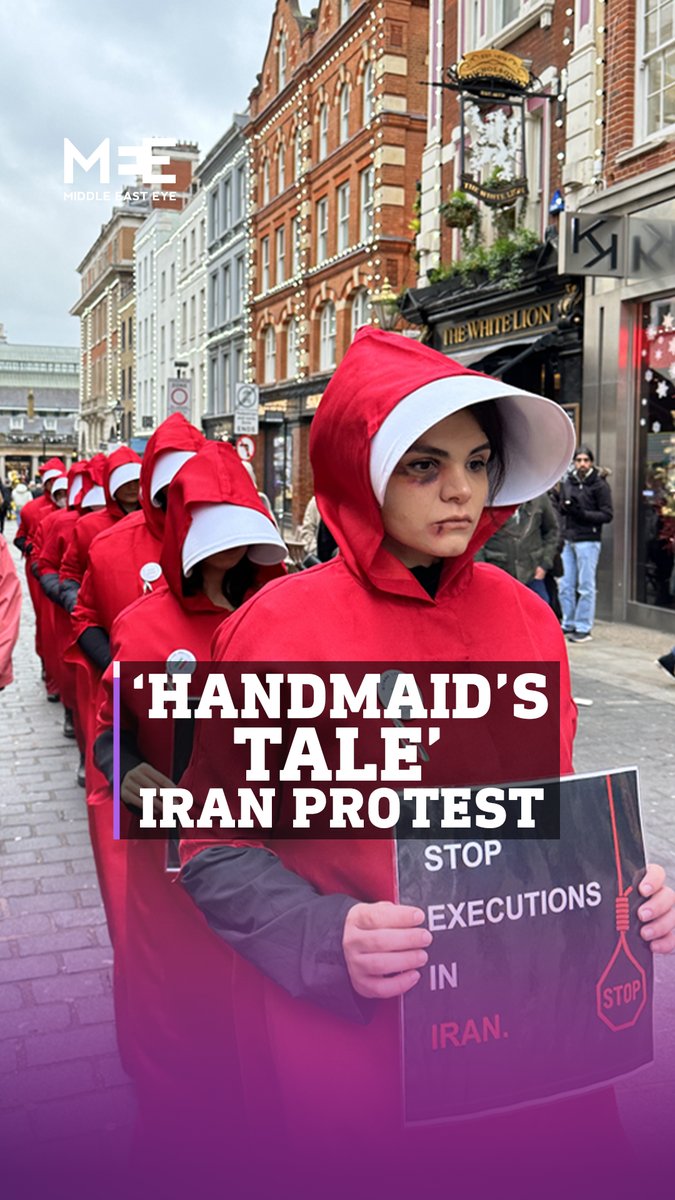 British-Iranian women stage a protest in London inspired by 'The Handmaid's Tale’ to raise awareness of the lack of women’s rights in #Iran, drawing parallels to the totalitarian regime of Gilead in Margaret E Atwood’s novel & the Hulu show. #MahsaAmini