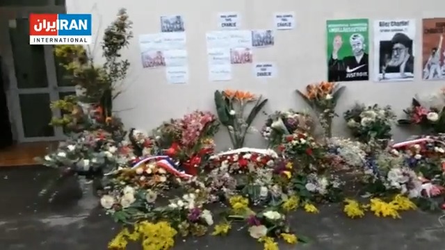 Iranians gather outside the Charlie Hebdo office in Paris with flowers following the Islamic Republic's threats against the publication's editors over cartoons mocking #Iran’s Supreme Leader Ali Khamenei. #MahsaAmini #IranRevoIution #اعتصابات_سراسری