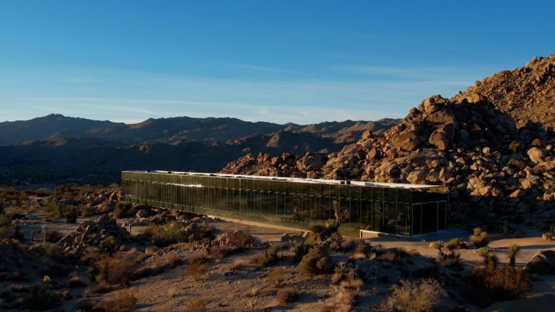 See inside $18 million 'Invisible House': The 5,490-square-foot building in Joshua Tree, which has been listed for $18 million, has a glass exterior that mirrors the landscape.