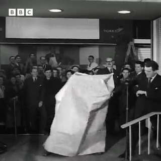 #OnThisDay 1953: Champion boxer Freddie Mills attempted to fight his way out of a paper bag, quite literally, in a top of the bill contest at the National Packaging Exhibition. Your announcer is Eamonn Andrews.