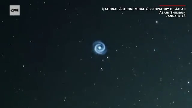 A Japanese telescope camera captured a "flying spiral" in Hawaii shortly after SpaceX launched a new satellite.