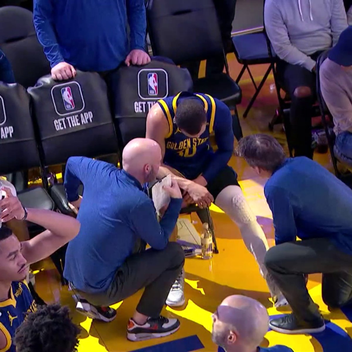 Steph Curry headed back to the locker room after bumping knees with McKinley Wright IV.