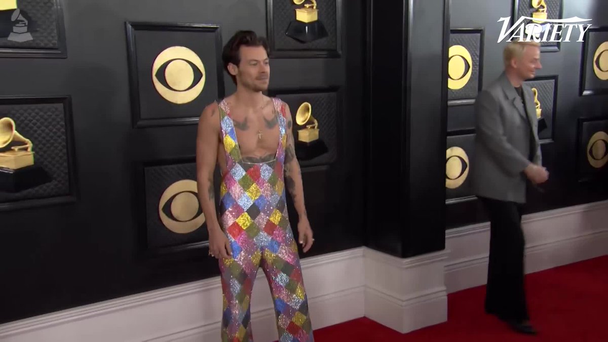 Harry Styles posing for photos at the #GRAMMYs.