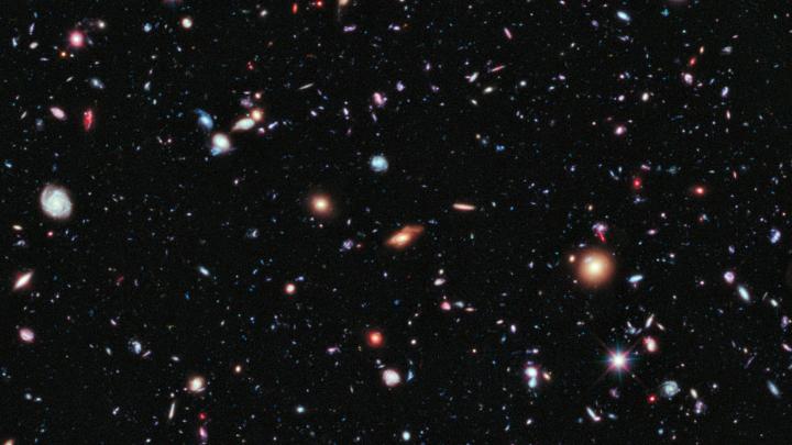 10,000 galaxies in a single shot. This sonification of the Hubble Ultra Deep Field (2014) plays a note for each galaxy when it emitted the light seen in the image. In under a minute, we can hear back nearly 13 billion years to the farthest galaxies.