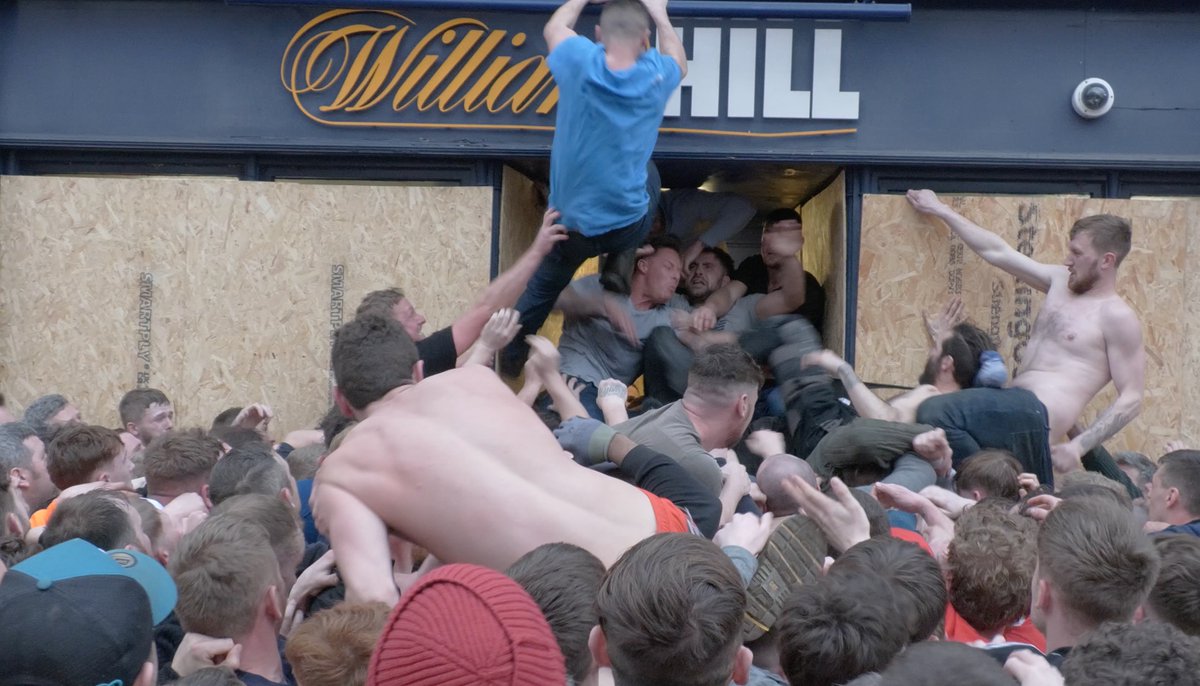 Brutal end to Atherstone Ball Game 2023. The last half an hour of the Pancake Day tradition saw punches thrown &amp; a betting shop damaged as teams battled to gain control of an oversized ball.