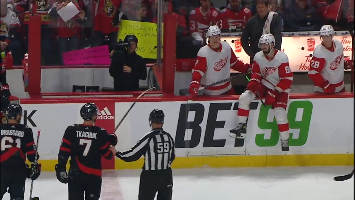 Brady Tkachuk (1 goal, 8 shots through 2 periods) challenges the Red Wings bench heading into the second intermission. #GoSensGo