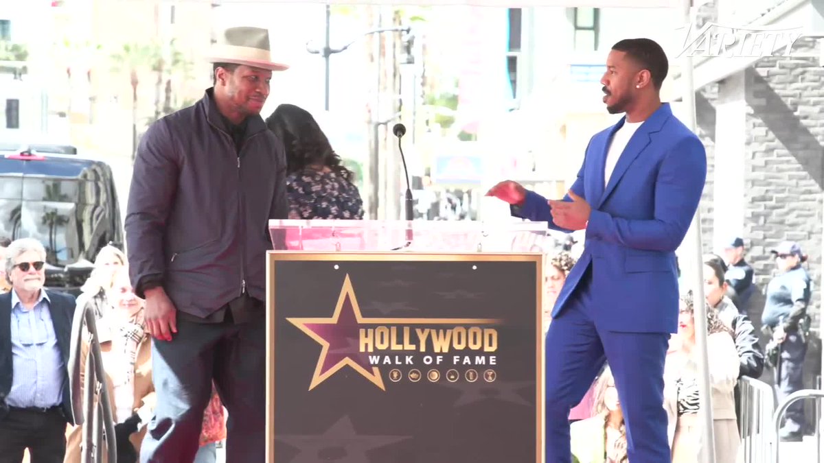 At Michael B. Jordan's Hollywood Walk of Fame ceremony, Jonathan Majors calls Jordan "Michael B. Handsome" and says that "Creed I" inspired him to get an Equinox membership.