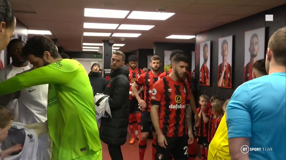 A lovely moment as Alisson Becker gives a young mascot his warm-up jacket 👊