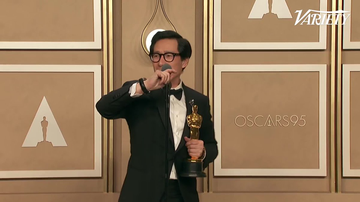 Ke Huy Quan makes his grand entrance into the press room holding his #Oscar. "Can you believe I'm holding one of these?"