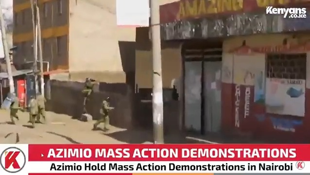 Police officers outnumbered & chased over a wall by demonstrators in Raila's convoy