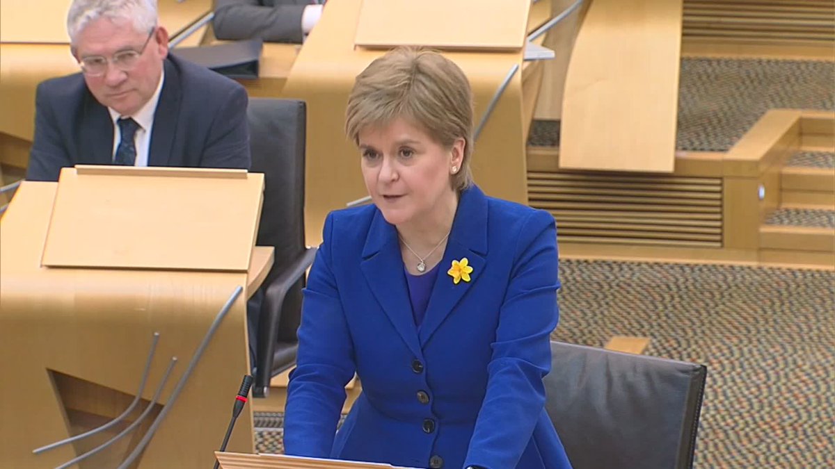 Nicola Sturgeon walks out of the Scottish Parliament after her final FMQs.