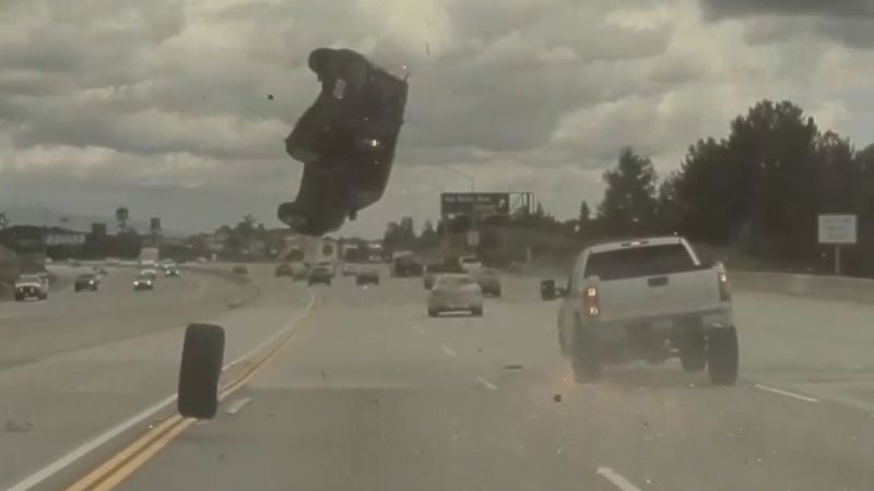 Dashcam video shows car flip mid-air on freeway after hitting a loose tire.