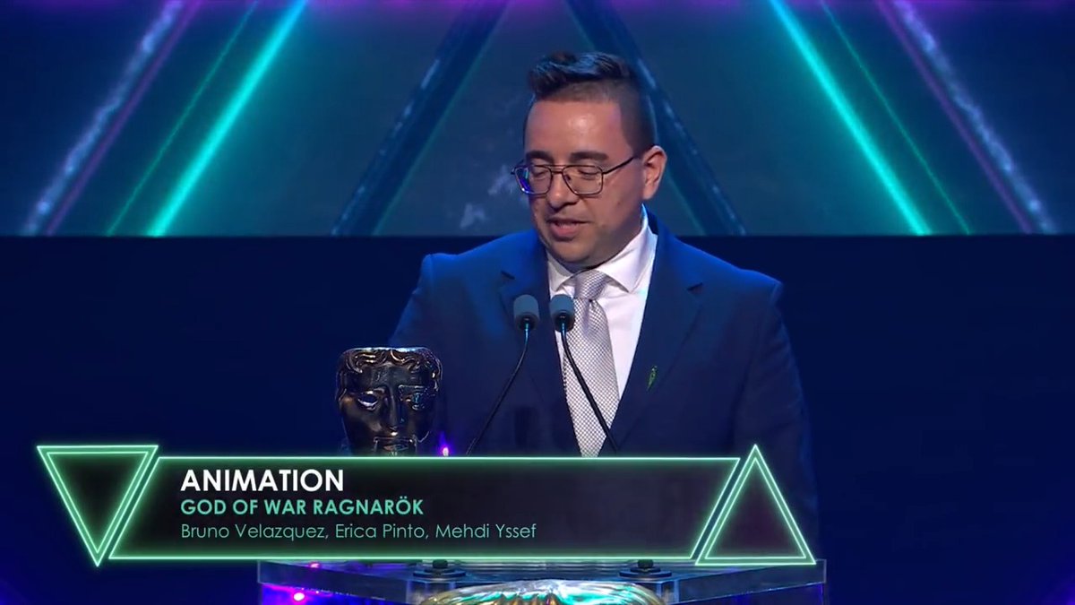 Bruno Velazquez accepts the BAFTA for Animation for God of War Ragnarök (with a Kratos handshake on the way down!) #BAFTAGamesAwards