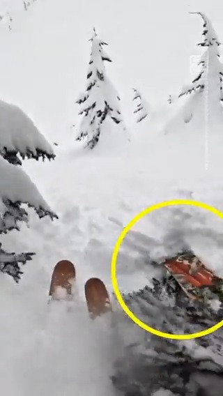 Watch the terrifying moment a skier comes across—and rescues—a snowboarder who was trapped under a mound of snow in a tree well 😰 (warning: distressing)