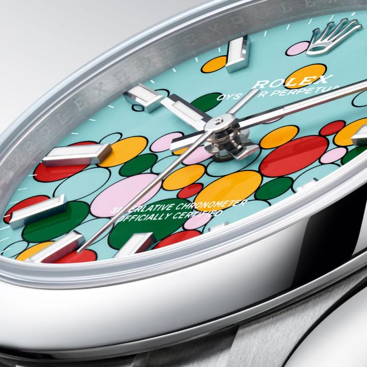 Alive with colour, vitality and positivity, the new lacquered dial of the #OysterPerpetual in 31mm, 36mm and 41mm is dotted with many-coloured bubbles that joyfully reunite the five hues introduced to the range in 2020. More #WatchesandWonders2023