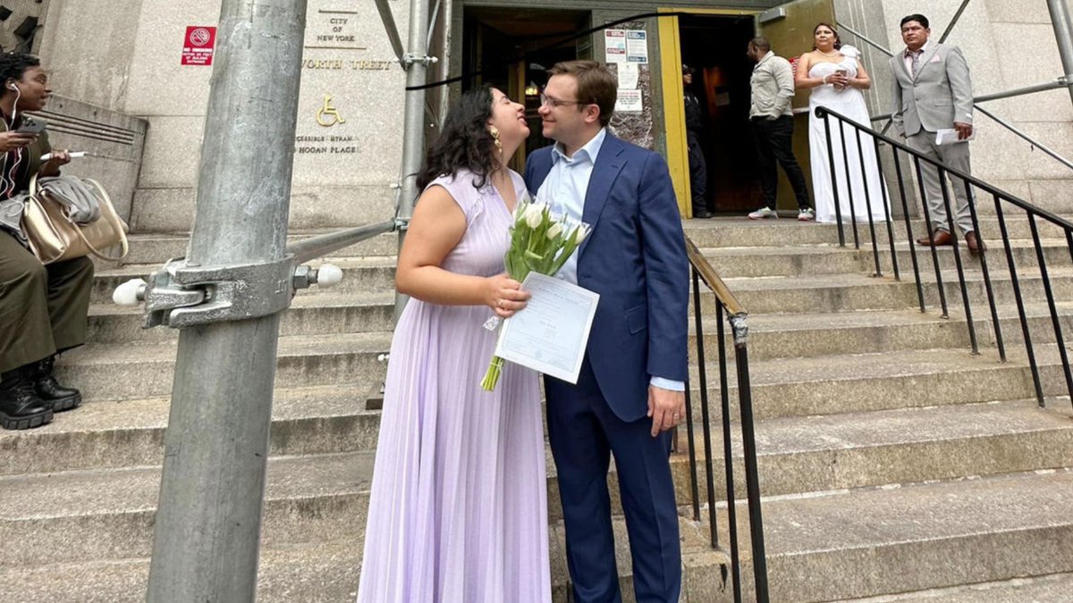 This couple was saying 'I do' at a New York courthouse while Donald Trump was pleading not guilty. #TheMoment