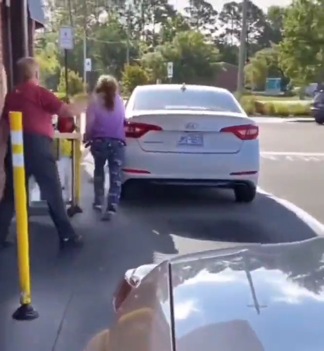 Women steps out of her car in the Drive-Thru at Chick-fil-A to go at it with the employees...