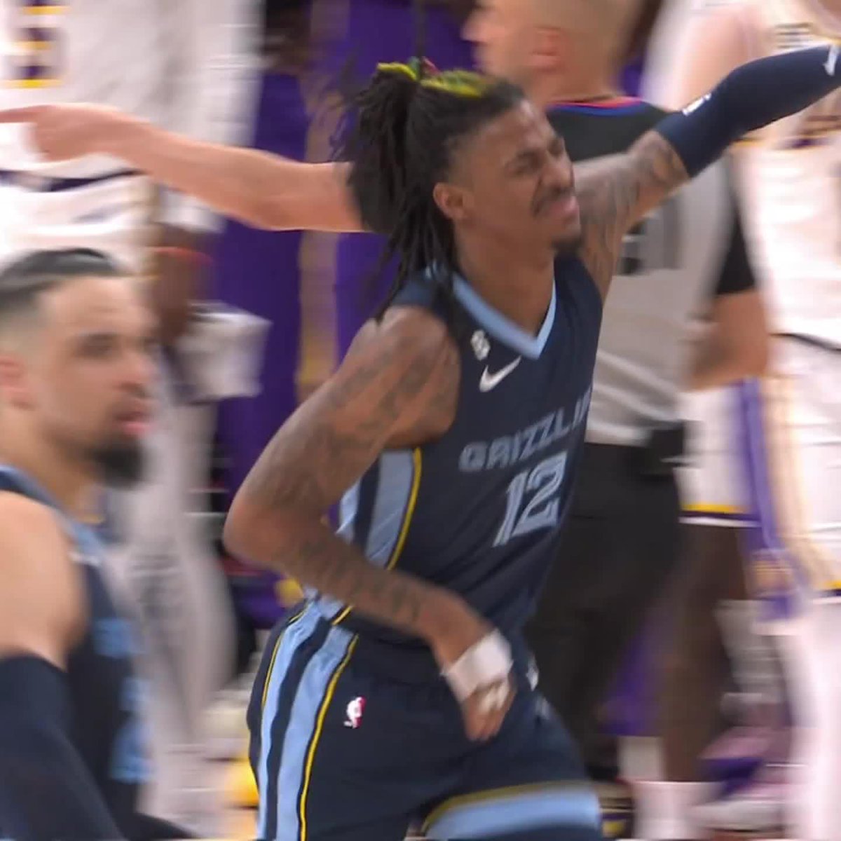 Ja Morant headed to the locker room with an apparent injury after this play.