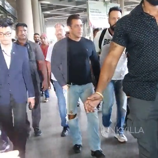 #SalmanKhan returns home after attending an event in Dubai; Papped with heavy security at the Mumbai airport.