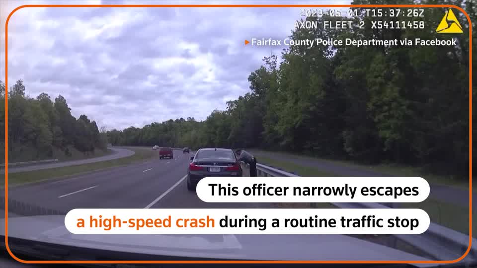 Dashcam footage from a patrol car shows a police officer narrowly escaping a high-speed crash during a routine traffic stop in Fairfax, Virginia