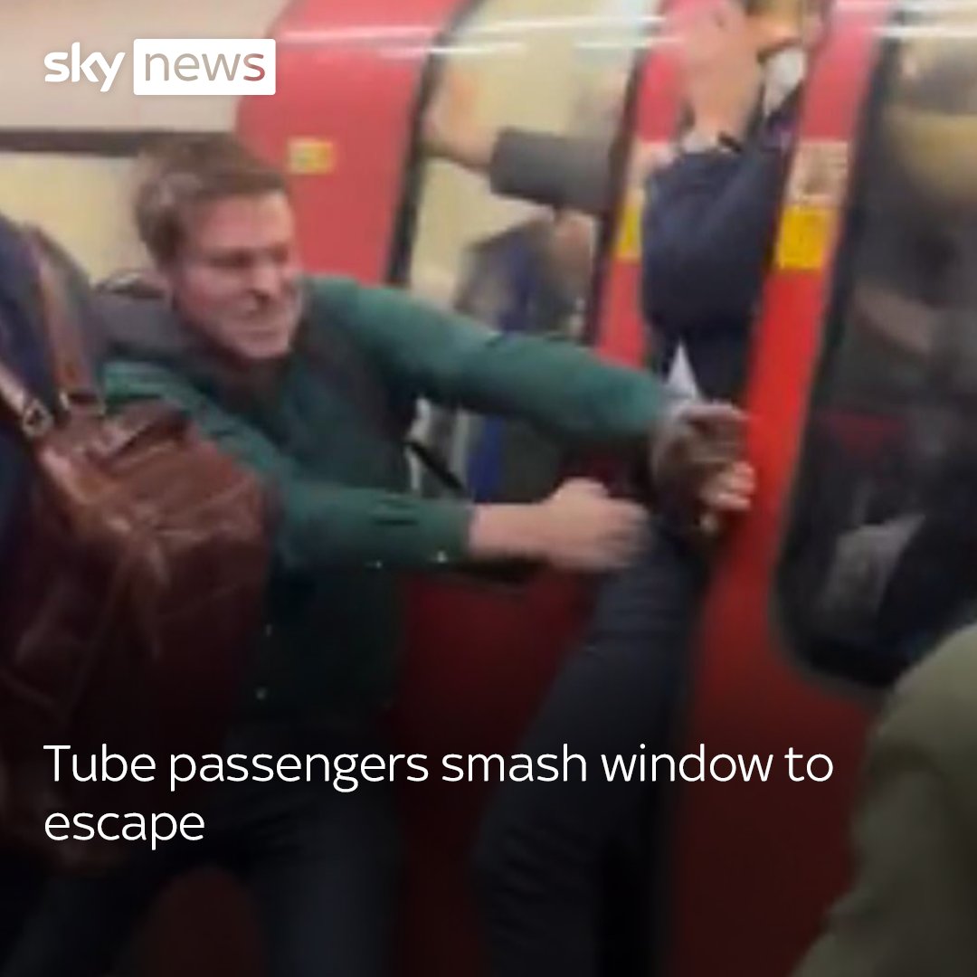 This video shows the moment tube passengers at Clapham Common smash glass to escape smoke caused by 'brake dust'