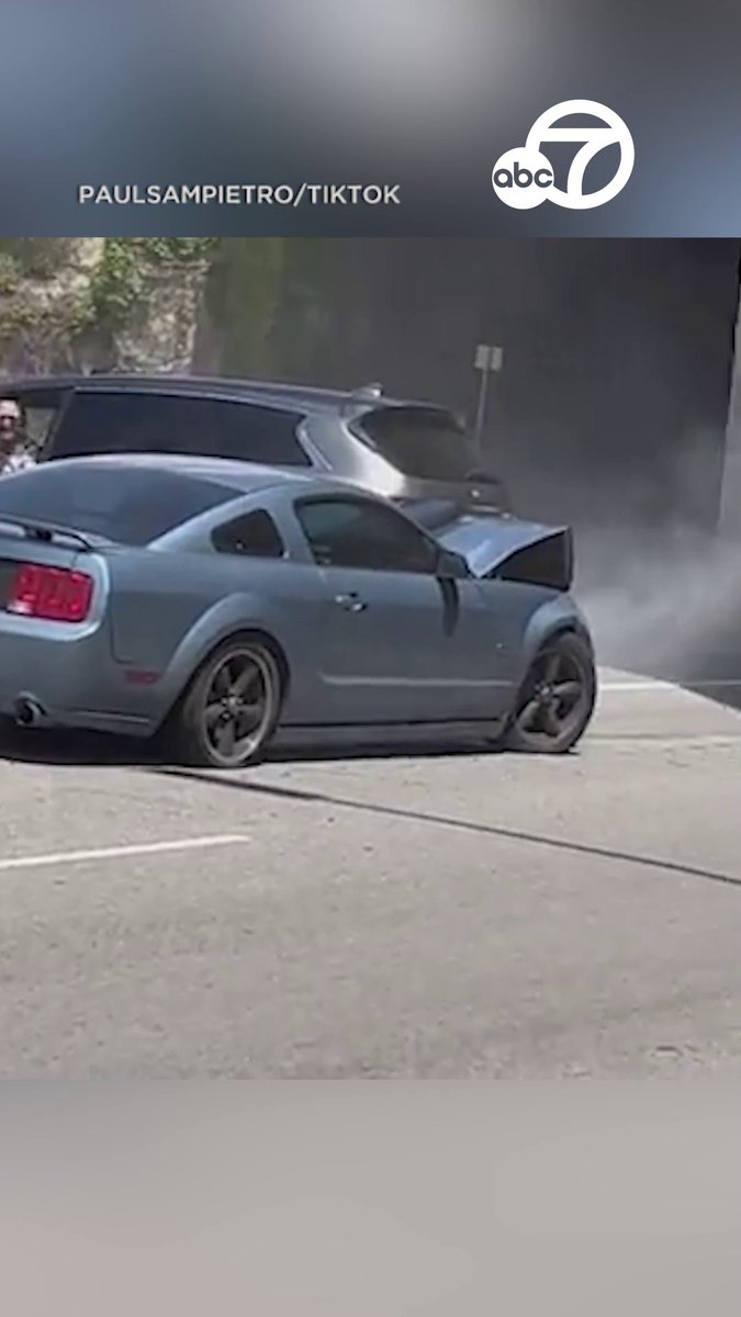 A wild video shows a driver aggressively slamming his Ford Mustang into at least four vehicles in what appears to be a massive road rage incident in Woodland Hills.