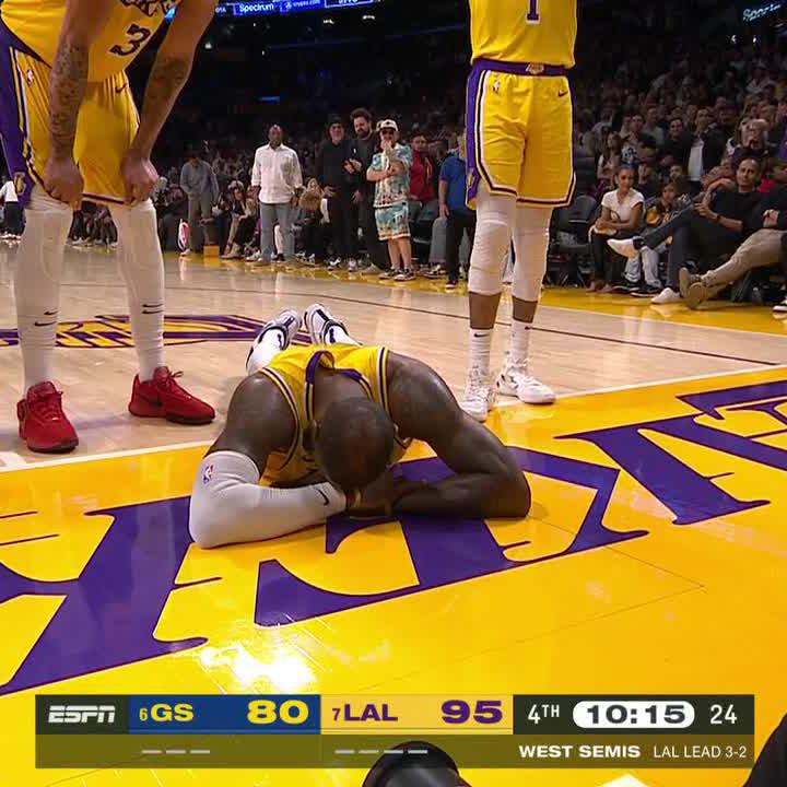 LeBron was slow to get up after taking a shot to the face.