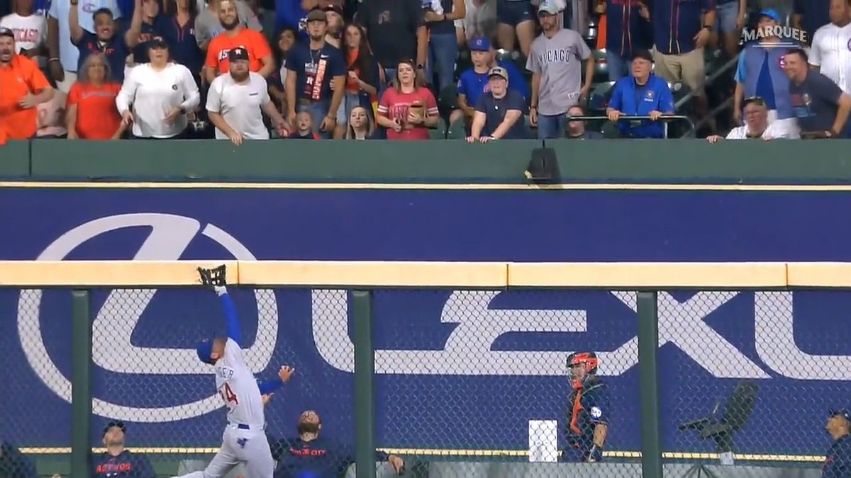 Cody Bellinger left Monday's game for the Cubs following this catch at the wall. (MLB)