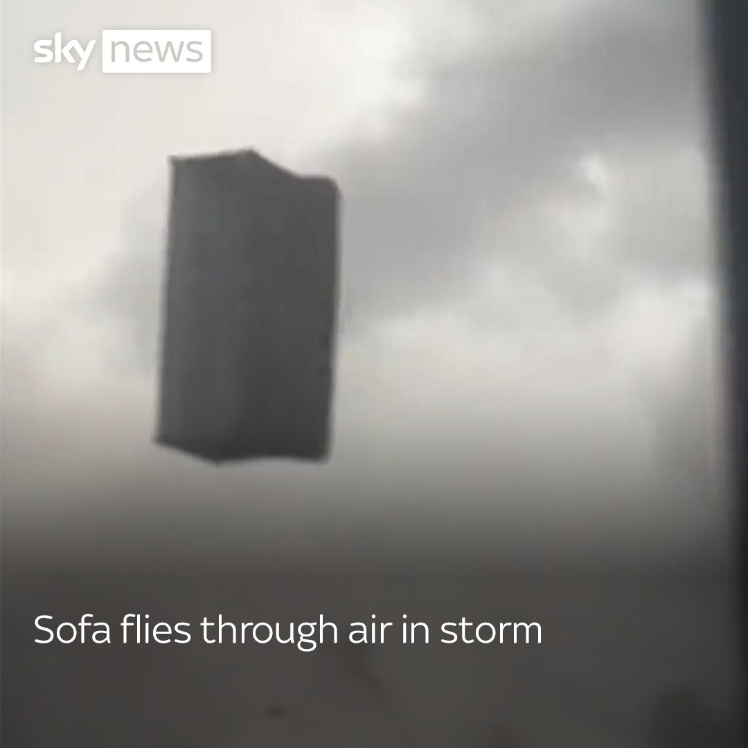 Watch the moment strong winds caused a sofa to fly through the air, before crashing into a building. This video has no audio. More videos: