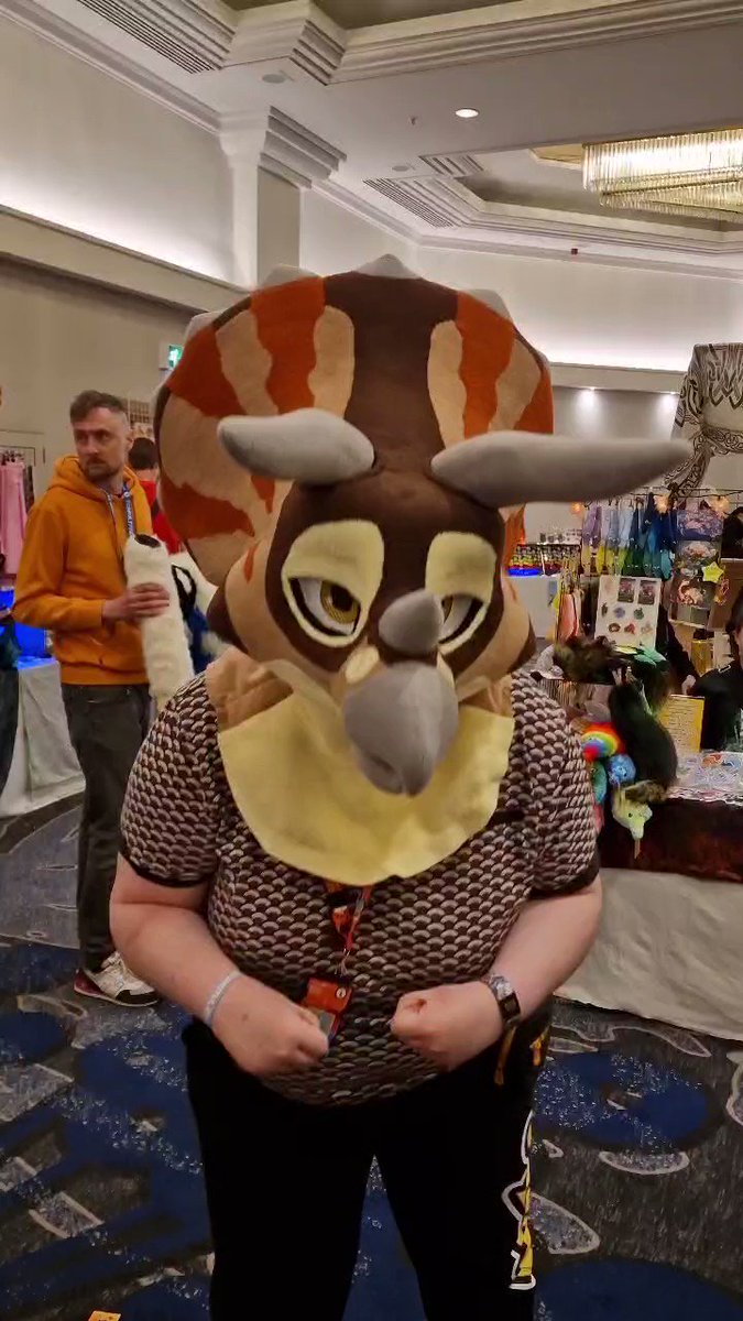 Check out the Chai-ceratops being modelled at #confuzzled ! He's still available, so if you're interested swing by table B40 in the dealers den! #dinofursuit #confuzzled2023