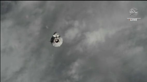 The SpaceX Dragon cargo craft is seen with with its nose cone open approaching the space station above western Asia. Watch live now...