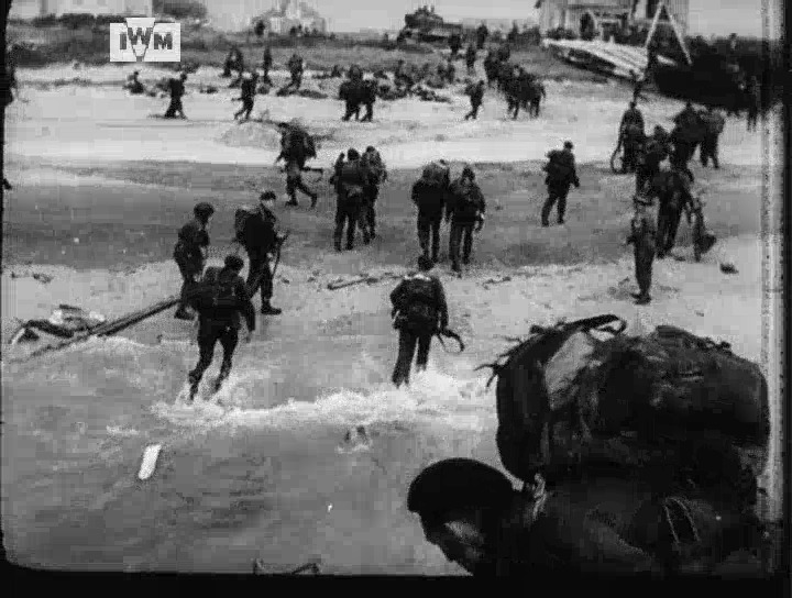 In this incredible footage shot on D-Day, 6 June 1944, troops of 45 Royal Marine Commando disembark on 'Queen Red' Beach at La Breche, amidst the burning tanks of the 22nd Dragoons and 13/18th Hussars. Learn more about Operation Overlord: © IWM A70 31-2