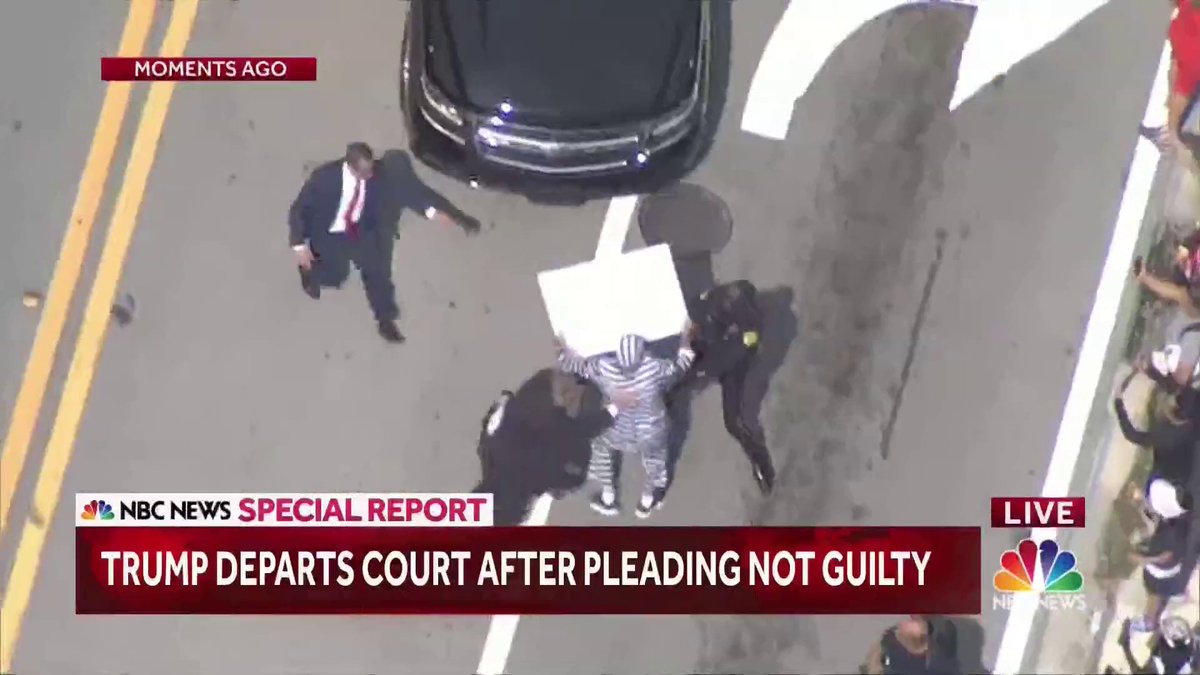 Protesters outside of the federal courthouse in Miami approach the Trump motorcade and get within feet of the vehicles following his arraignment.