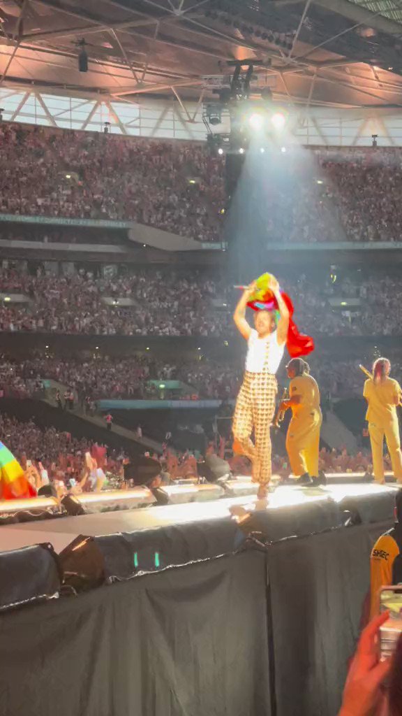 Harry proud of himself for catching a shirt and testing his spidey senses on stage at Wembley Stadium in London, UK - 13 June (via dhall91)