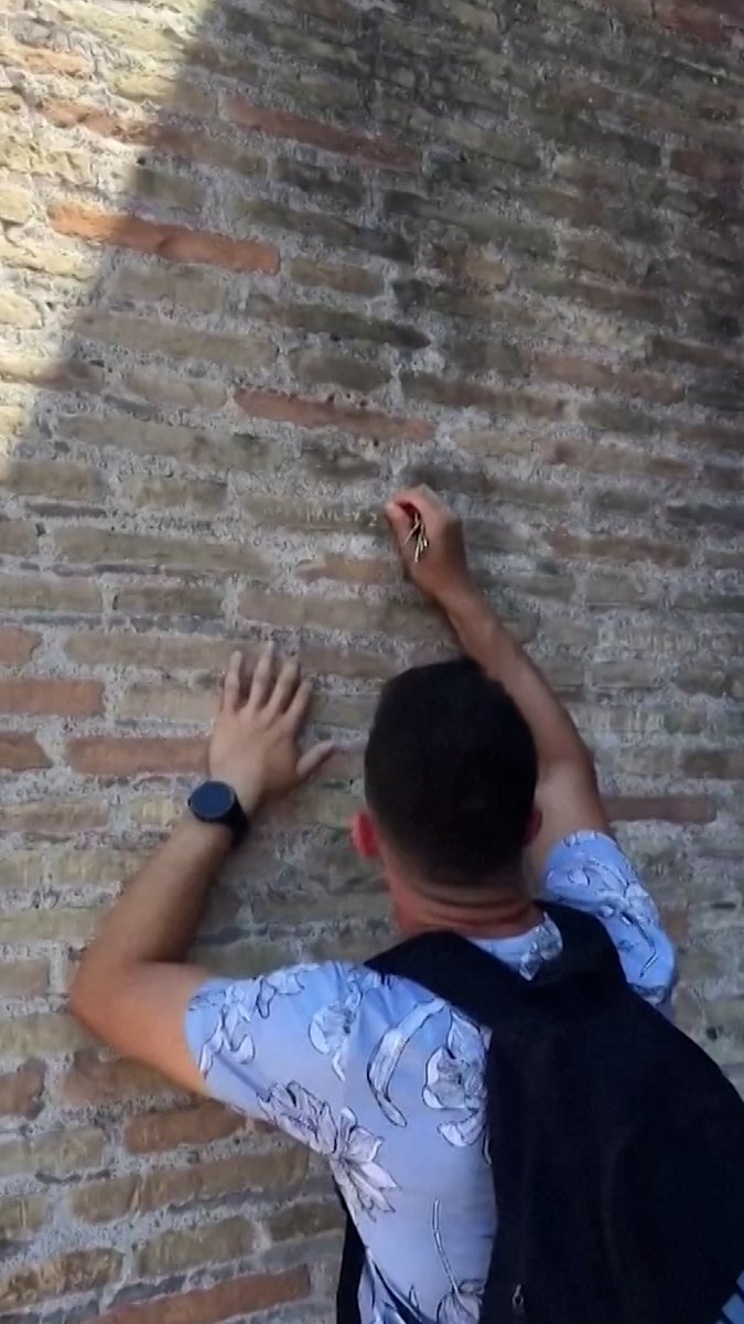 Italian officials have expressed outrage after a viral video surfaced of a tourist carving an etching into the wall of the Colosseum in Rome. The unidentified man reportedly carved the inscription ‘Ivan + Hayley 23’ into the ancient venue’s stone facade with a key.
