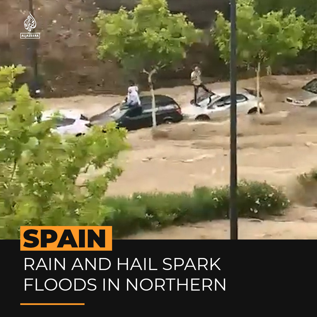 Videos show people desperately clinging to their cars as heavy rains and hailstorms spark flash floods in Northern Spain ⤵️