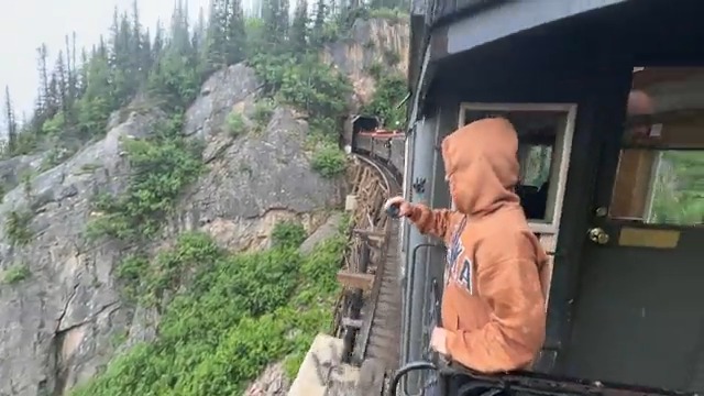 Riding an old train through a very dark tunnel on the gold rush trail in Alaska..