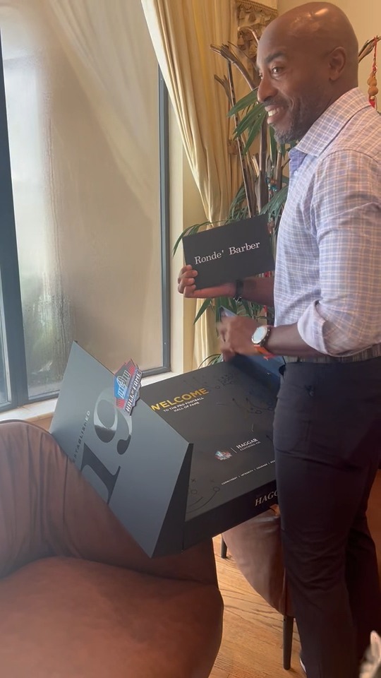 When it came time for Rondé Barber to open the package with his Haggar Clothing Co. Gold Jacket for the first time, he didn't do the honors by himself. His dog, Jagger, helped.