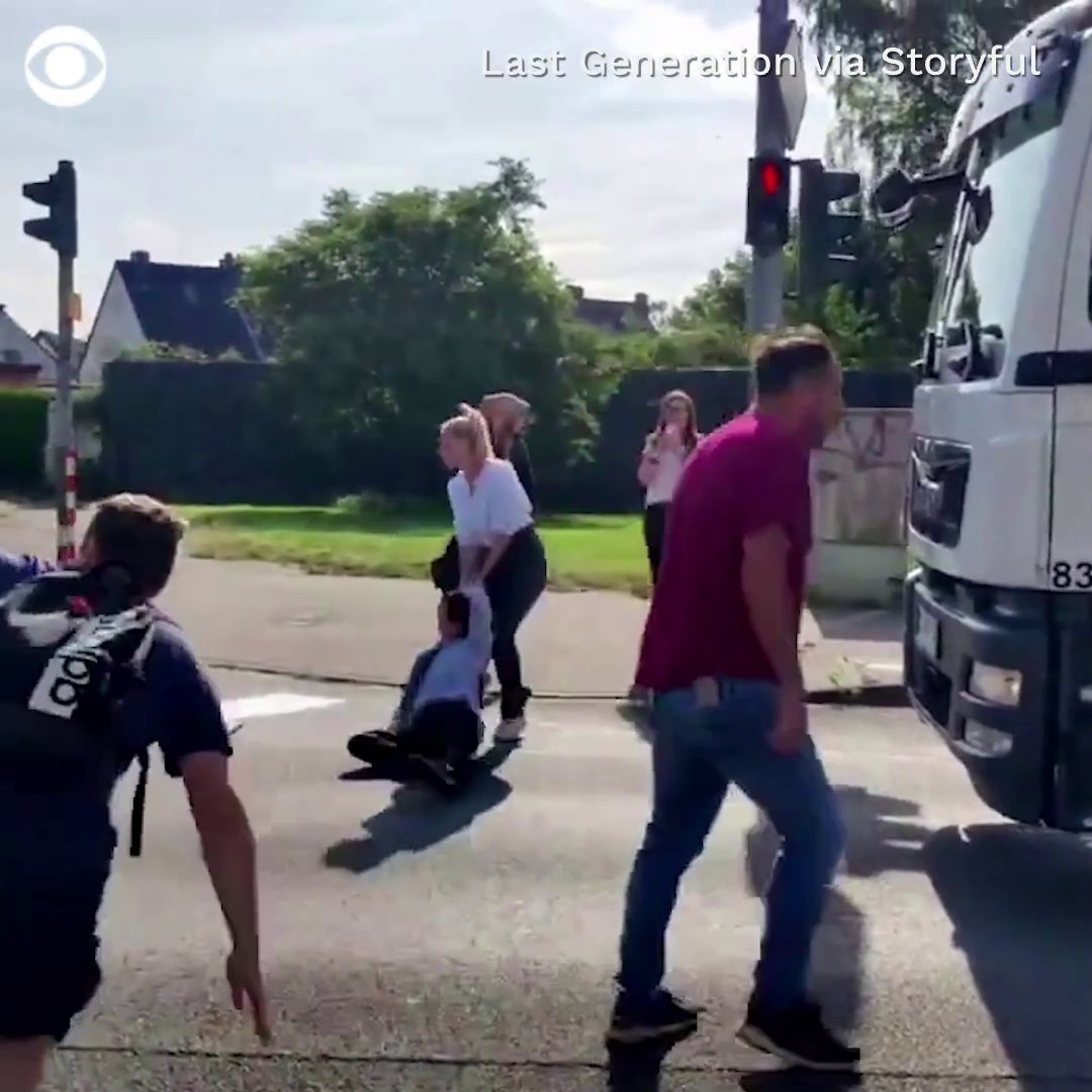 Climate change activists were carried and dragged by their hair off the road during a traffic obstruction protest in Germany.