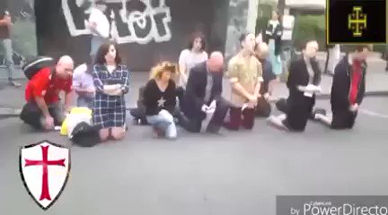 Interesting street scene in France as a group of Catholics pray an “Ave Maria” in the street and a Muslim man approaches with a stereo on full volume and stands next to them. One of those praying stands up and does a "laying on of healing hands" worthy of the biggest applause!