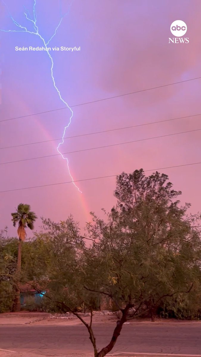 A spectacular sight over southern Arizona: A bolt of lightning flashes across the sky at the same time as a rainbow.