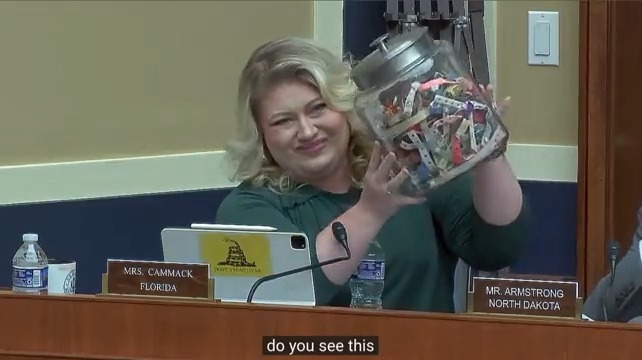 Rep. Cammack: Do you see this jar? Sec. Becerra: It looks like candies or snacks. Rep. Cammack: These are wristbands the cartels force people to wear when they cross the border. If you're not wearing one when you cross, the cartels will take a limb, like an arm or leg.