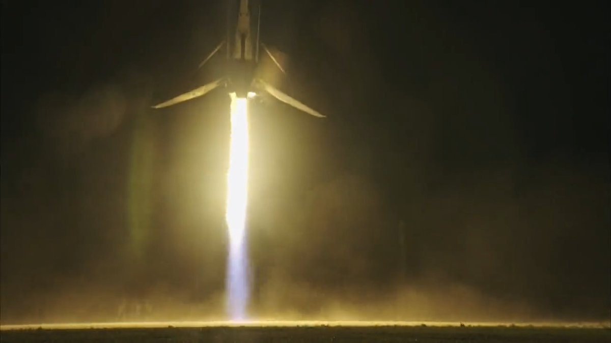 Falcon Heavy side boosters returning to Earth