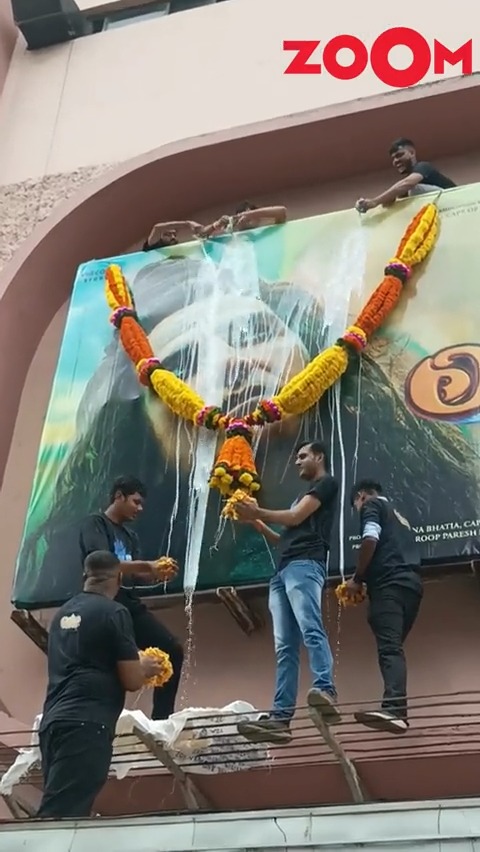 Fans shower Akshay Kumar's OMG-2 poster with milk and flowers as the film gets release today #OMG2 #AkshayKumar