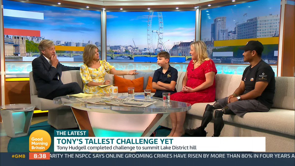 An eight-year-old boy who had both legs amputated after he was abused as a baby has walked to the summit of a Lake District fell. Tony Hudgell was surprised by double amputee former Gurkha Hari Budha Magar on the trek Tony has raised almost £2 million for charity.