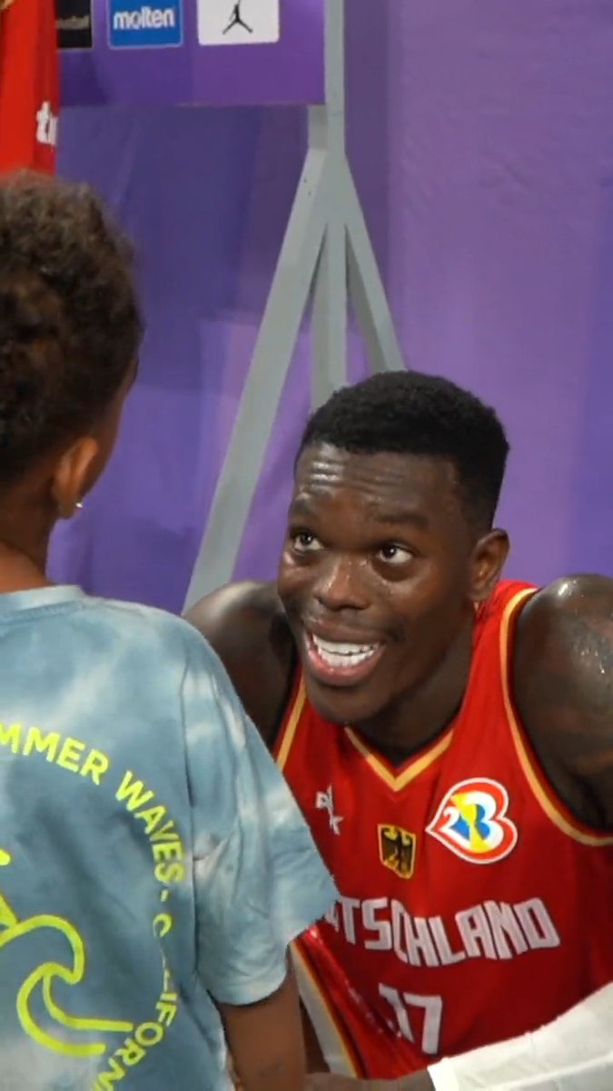 Dennis Schroder celebrates with his son after putting up 30 PTS, 8 AST, 4 STL in Germany's win over Australia @FiBAWC ❤️