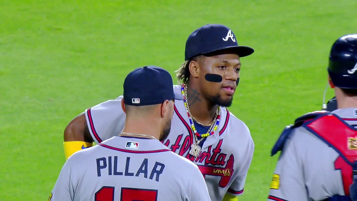 Multiple fans in Colorado ran onto the field and tangled up with Ronald Acuña Jr. in right-center before being detained by security.