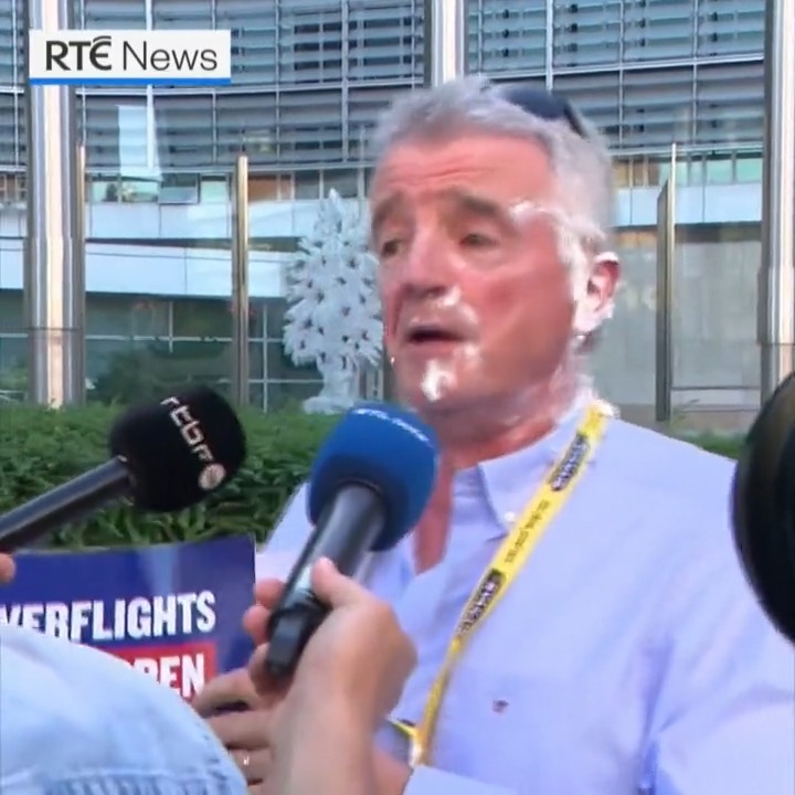 Ryanair boss Michael O'Leary got a rude welcome in Brussels today when he received two cream pies to the face while standing next to a cardboard cutout of EU chief Ursula von der Leyen | Read more: